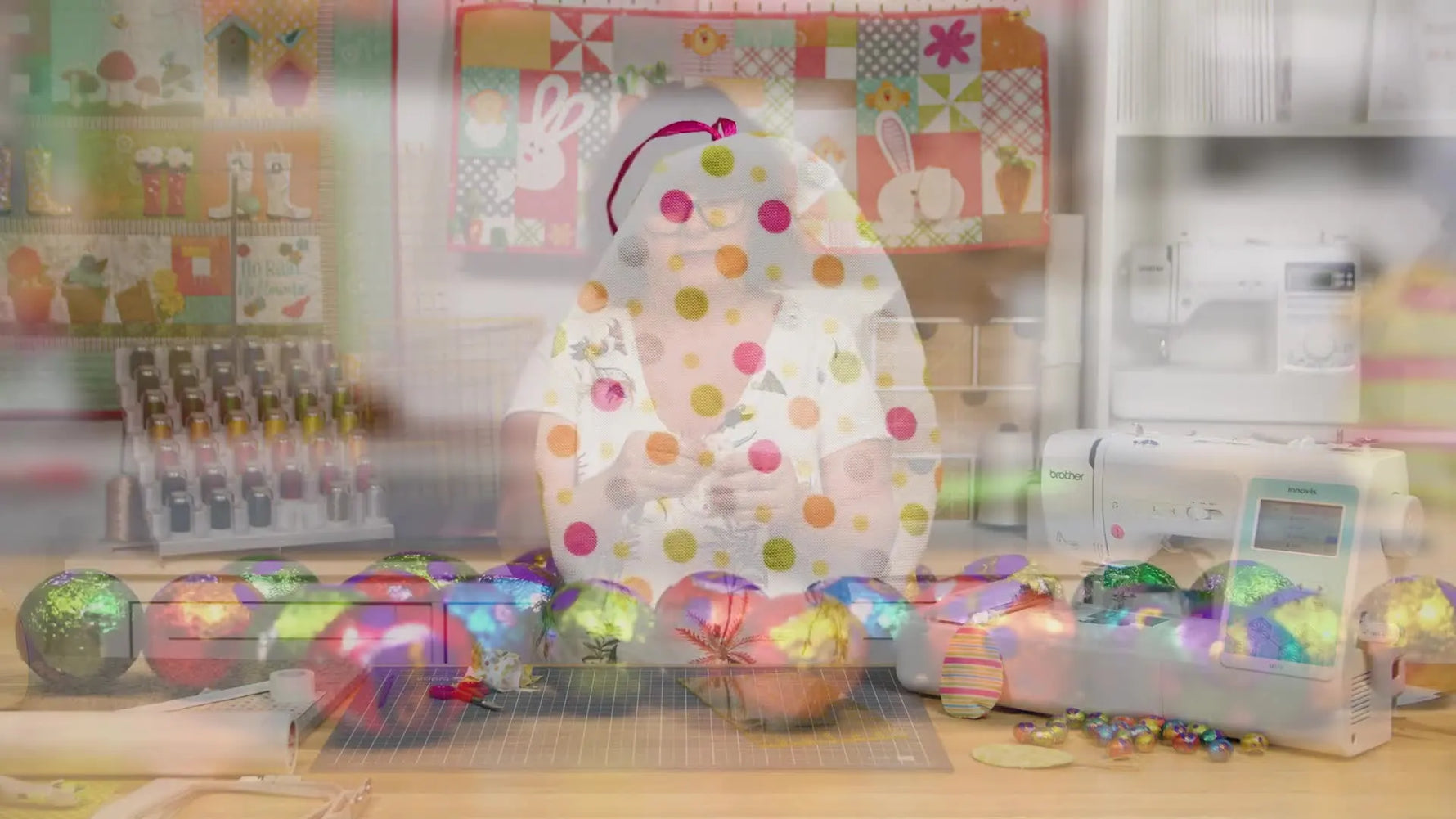 A finished in-the-hoop Easter egg pocket stands upright, filled with colorful chocolate eggs for a neat final reveal.