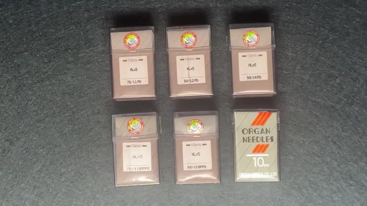 Overhead view of Organ Heavy Duty needle packets with the HLx5 code clearly visible.