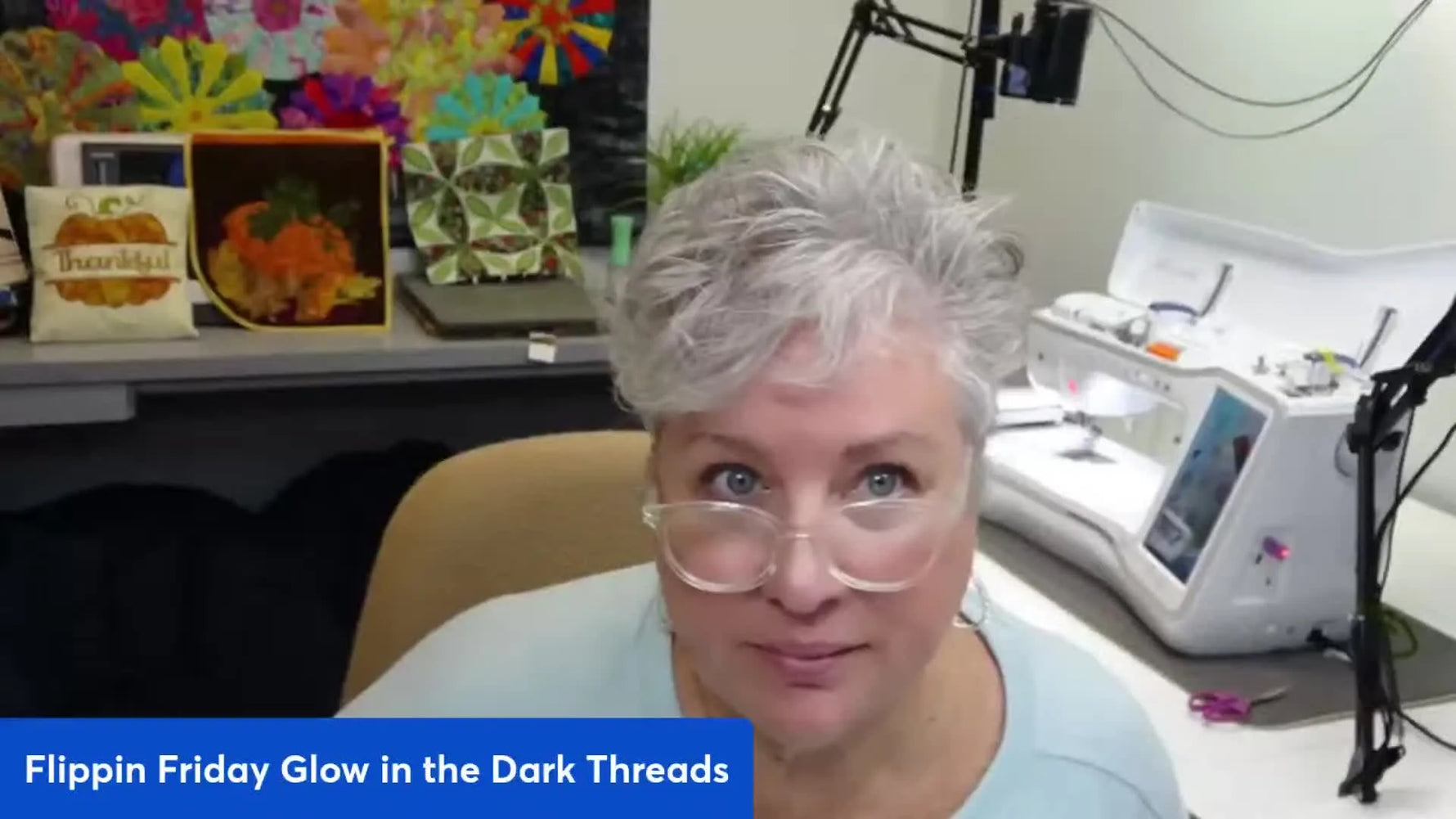 Host Amy Bachman introducing Flippin Friday with embroidery machine in background.