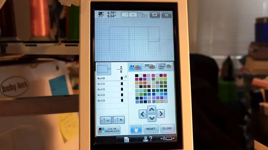 A close-up of the Baby Lock Enterprise screen as the stylus taps the Hand icon to program a Reserve Stop before the next stitch sequence.