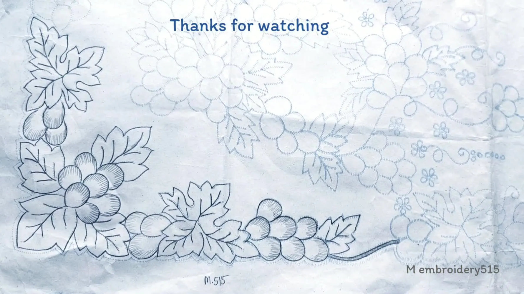 Finished machine embroidered cutwork border with a central flower.