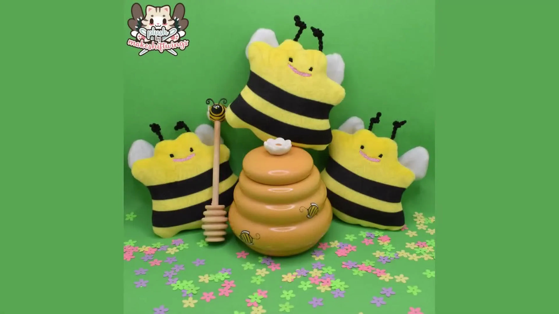 A wide shot of several finished bee ITH plushies arranged together, showing consistent stitching and clean finishing.