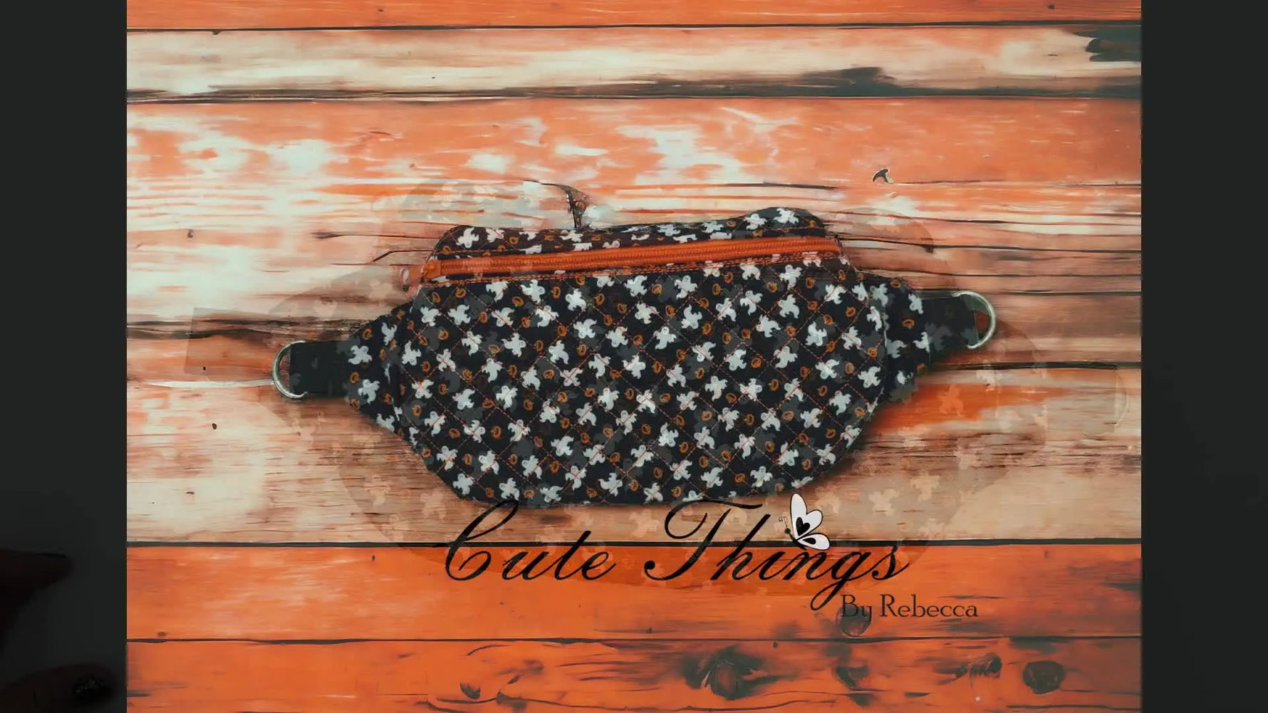 The finished Front Zip Diamond Luna bag with a front zipper and side D-ring tabs displayed on a wood background.
