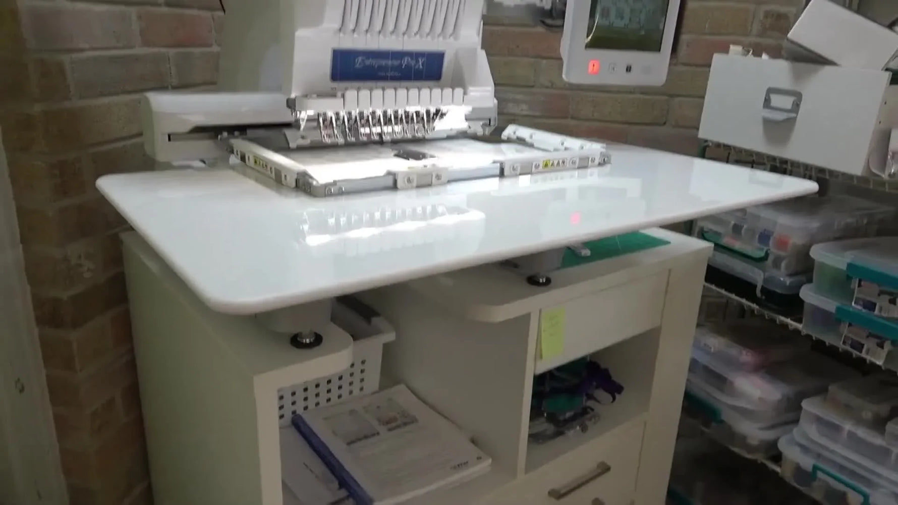 A full view of a Brother PR1055X with the wide quilting table and magnetic sash frame fully installed and ready for stitching.
