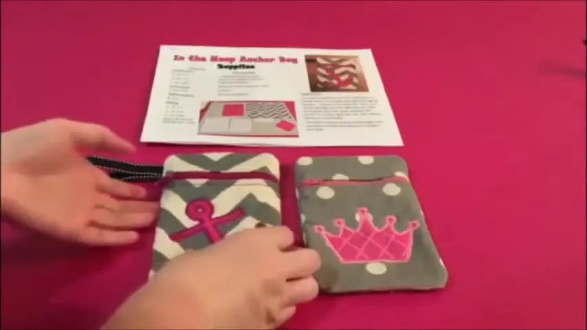 Two finished ITH zippered pouches (anchor and crown) are displayed beside the printed instructions, showing the clean fully lined interior result.