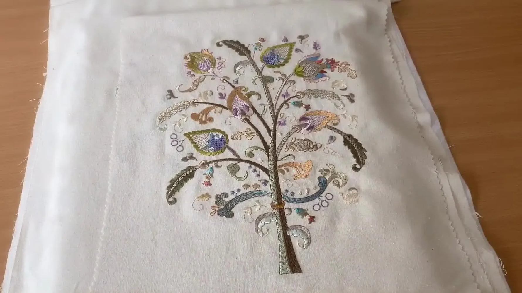 A finished Jacobean Tree of Life embroidery stitched on Noil silk, showing clean joins across multiple hoopings.