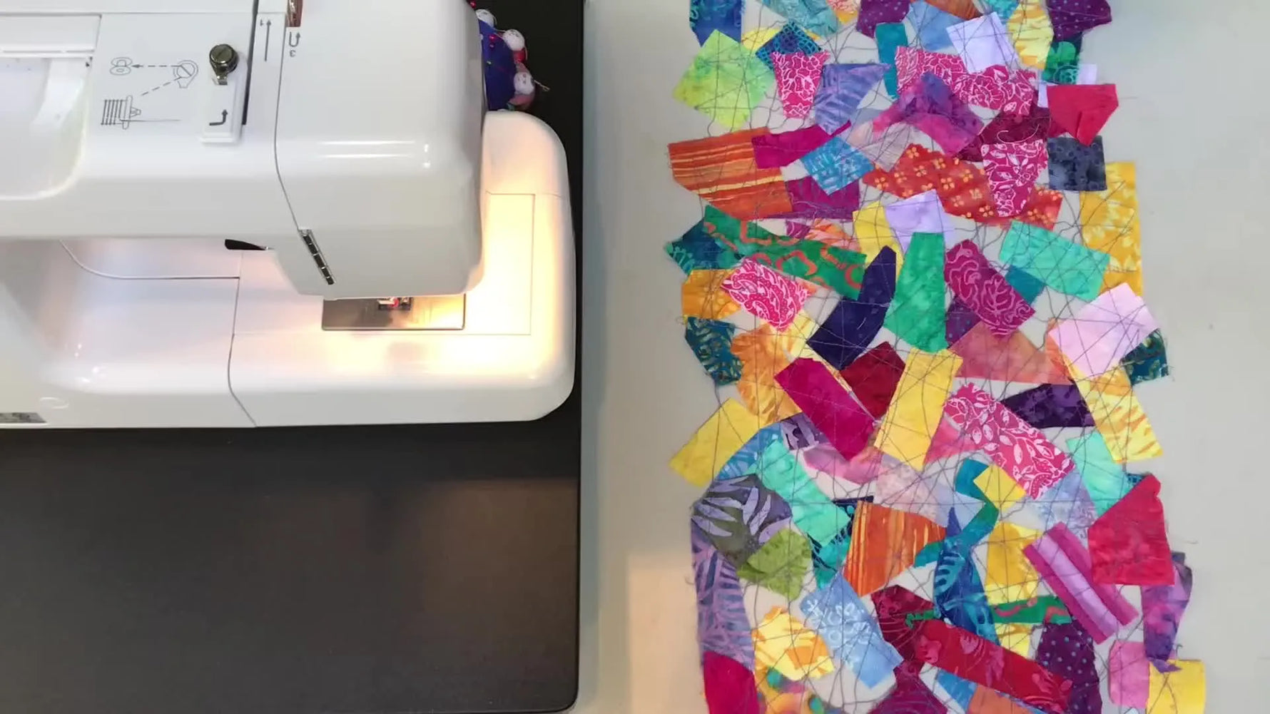 Finished batik lace table runner next to a sewing machine