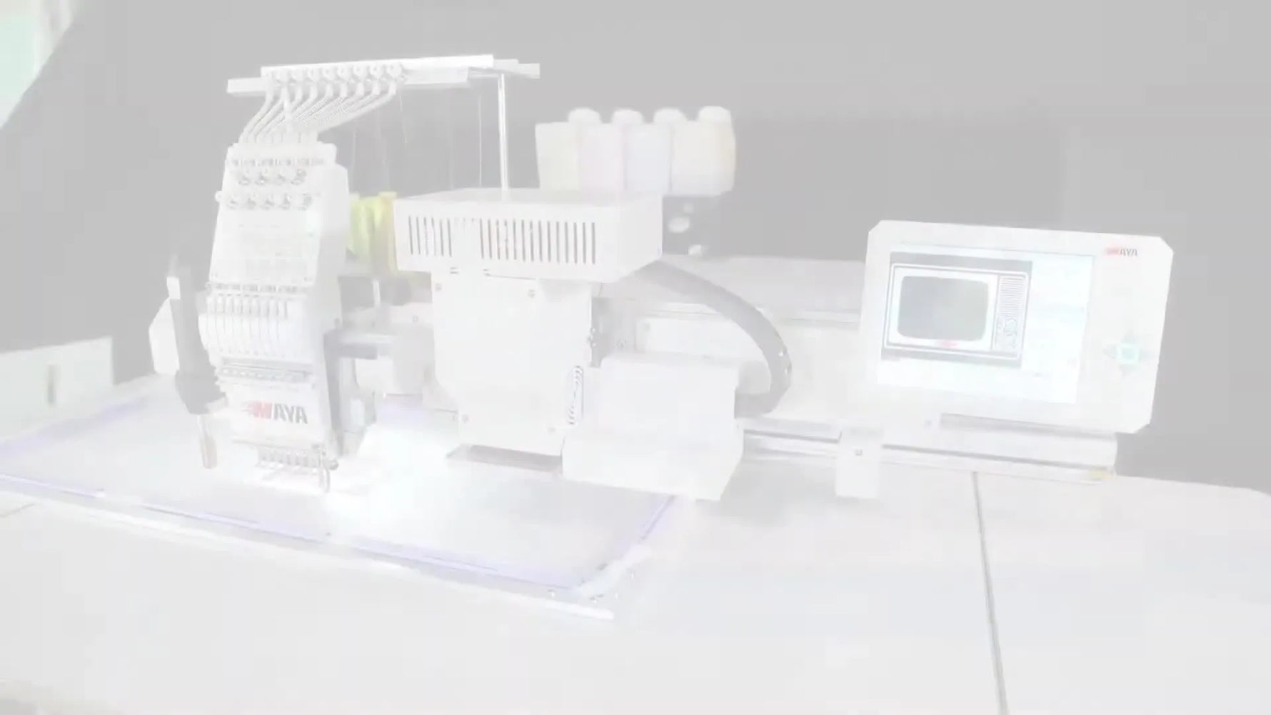 A wide hero shot of the Mix Printing & Flat Embroidery Machine showing the print module, embroidery heads, and ink tanks in one integrated production line.