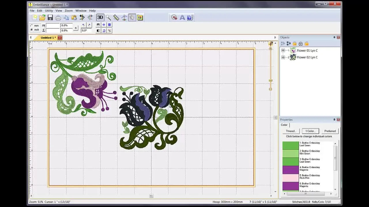 Two floral embroidery designs overlap in the center of the hoop boundary inside Embrilliance Essentials, showing the immediate result of merging stitch files.