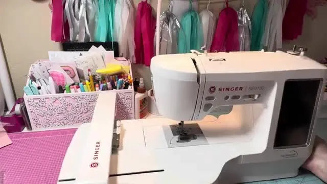 The Singer SE9180 sits fully assembled with the embroidery unit attached, ready for first power-on and calibration.