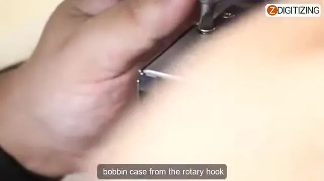 A syringe oiler places precise drops of oil into the Ricoma MT-1502 rotary hook area during routine maintenance.