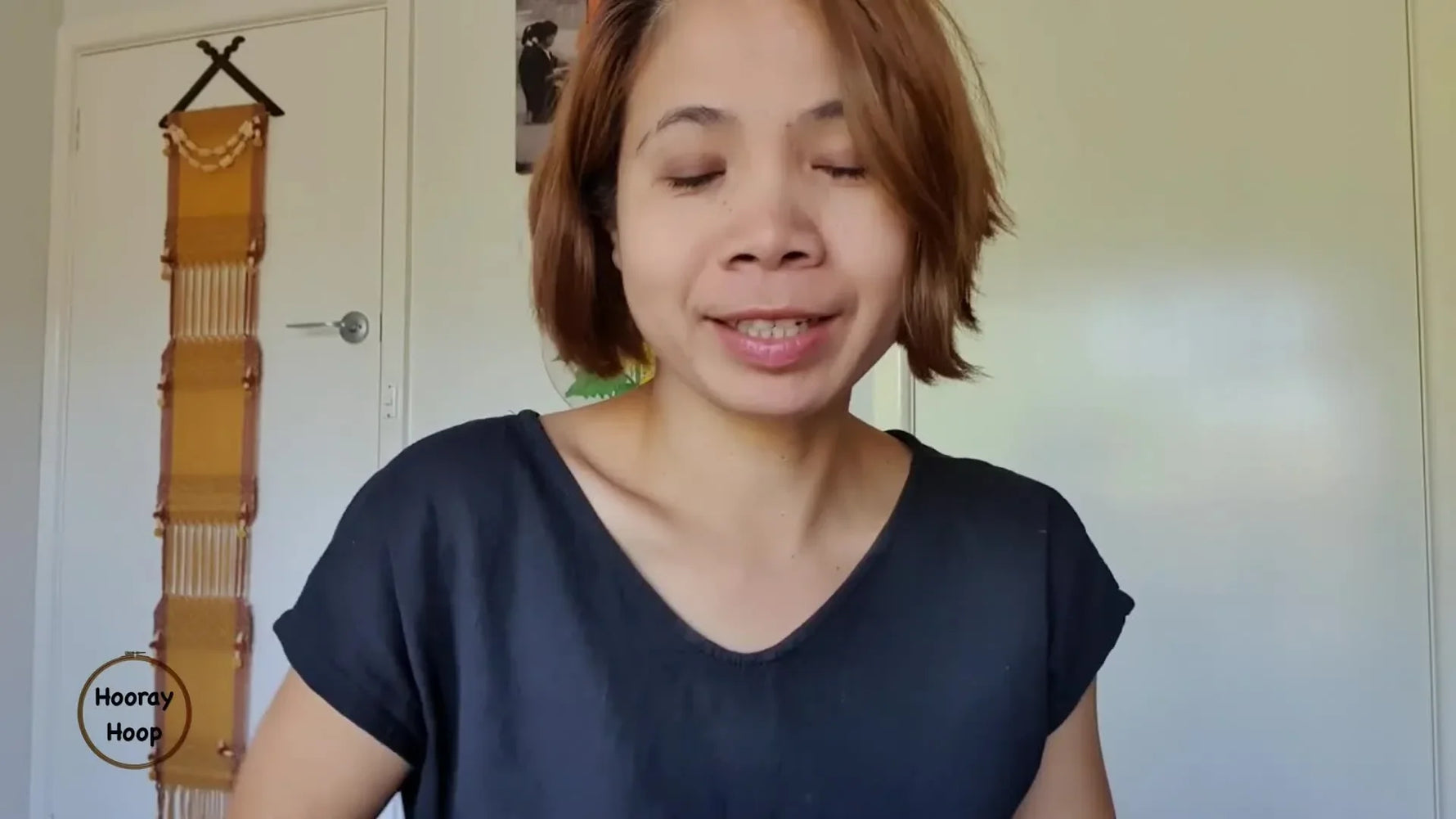 Creator holding the finished Happy Cactus embroidery, showcasing the cute design.